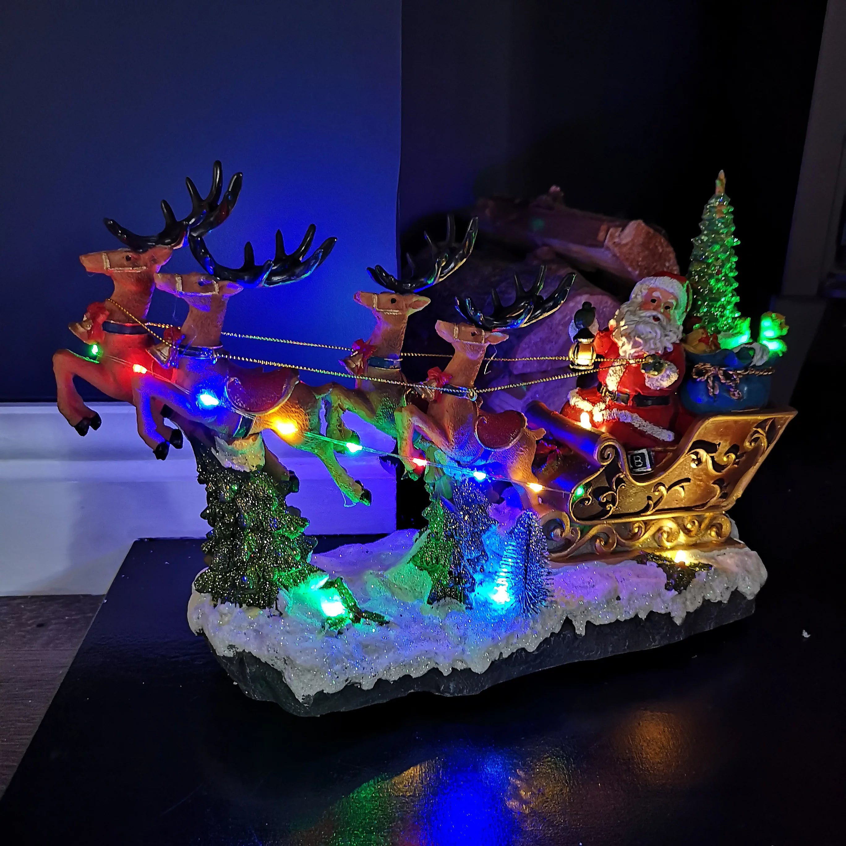Lit Musical Santa Riding Sleigh with Turning Tree - 34.5cm